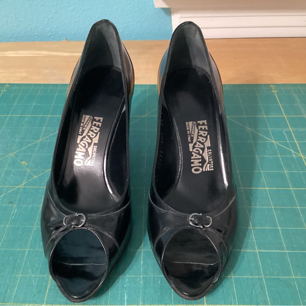 Salvatore Ferragamo black peep toe pumps with silver buckle detail